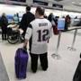 New England Patriots fan Anthony Monaco waited in line for his flight to Phoenix. 