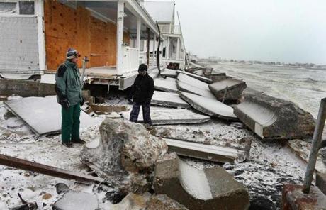 In Marshfield, heavy surf washed out a sea wall Tuesday morning.
