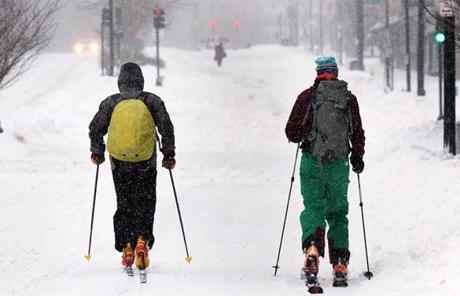 Two residents made their way on cross-coutnry skiis in downtown Boston.
