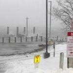 A view of the Chatham Fish Pier and parking lot shortly after high tide Tuesday morning. 