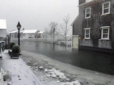 cy water covered a street in Nantucket early Tuesday.
