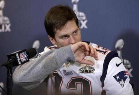 New England Patriots quarterback Tom Brady listens to a question during a news conference Wednesday, Jan. 28, 2015, in Chandler, Ariz. The Patriots play the Seattle Seahawks in NFL football Super Bowl XLIX Sunday, Feb. 1, in Phoenix. (AP Photo/Mark Humphrey)
