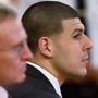 Aaron Hernandez (center) listened during his trial on Thursday.