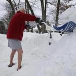 The weather did not stop John Crossman, 79, from wearing shorts as he shoveled in Hudson.
