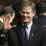 Former U.S. Sen. Scott Brown greeted people on the floor of the House Chamber at the Statehouse.