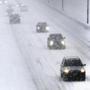 Drivers crawling along on the Mass. Turnpike in Newton coped with low visibility on Monday.