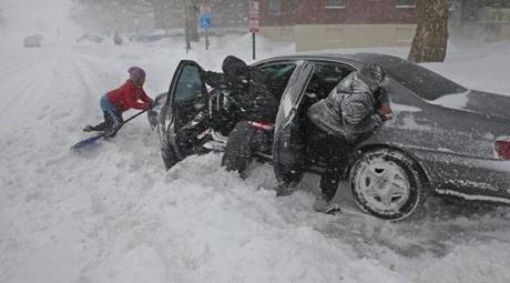 Shirley Jean helped Mike Jackson and his wife Cay Jackson as they tried to move their car on Old Colony Boulevard in Boston. 
