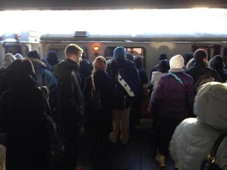 Commuters waied for a train at the Sullivan Square MBTA station on Tuesday.

