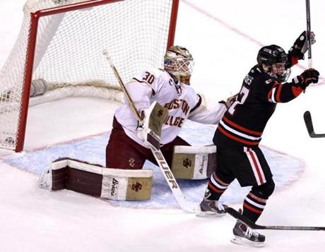Northeastern forward Dalen Hedges celebrated a goal by Dustin Darou to defeat Boston College, 3-2. 
