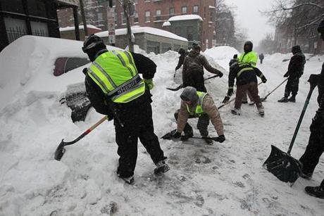 Crews were digging out handicapped spots and ramps on Shawmut Avenue in Boston.
