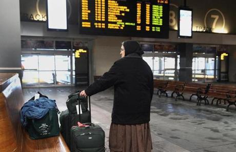  Lavina Kilmer waited for a 9 a.m. Amtrak train to Brunswick, Me., at North Station on Tuesday. The board showed that all trains were canceled except for Brunswick, Me. 
