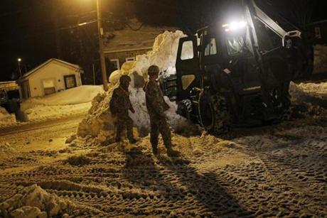 Members of the Mass. National Guard helped with snow removal in Weymouth Tuesday night.
