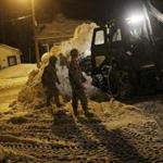 Members of the Mass. National Guard helped with snow removal in Weymouth Tuesday night.