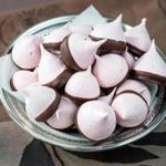 Pink meringue kisses dipped in chocolate 