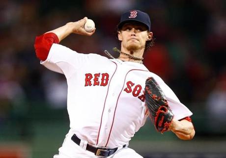 BOSTON, MA - SEPTEMBER 23: Clay Buchholz #11 of the Boston Red Sox pitches against the Tampa Bay Rays in the first inning during the game at Fenway Park on September 23, 2014 in Boston, Massachusetts. (Photo by Jared Wickerham/Getty Images)
