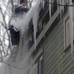 With ice dams an acute threat, Jay Bullens Jr. of Able Roofing used a sledgehammer to clear one from a house in Brookline this week.