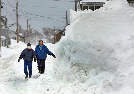 Forecasters say parts of Mass. could see up to 15 inches of snow this weekend. Pictured: A snow drift on Beach Avenue in Hull.

