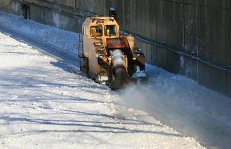 A jet-powered track cleaner on loan from New York City blew snow off the tracks at Quincy Center Station on the Red Line  in anticipation of the weekend blizzard.
