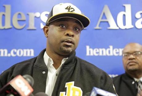 Jackie Robinson West Manager Darold Butler speaks during a news conference, Thursday, Feb. 12, 2015, in Chicago. Team organizers hired Attorney Victor Henderson, who says he's working with local Little League officials to investigate the international governing body's decision to strip the Chicago team of its national title. (AP Photo/M. Spencer Green)
