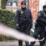 Police stood guard early Sunday in Copenhagen, Denmark, at the site where a man was shot and killed by officers. Officials said they believe the man was responsible for two deadly attacks at an event promoting freedom of speech and on a synagogue.