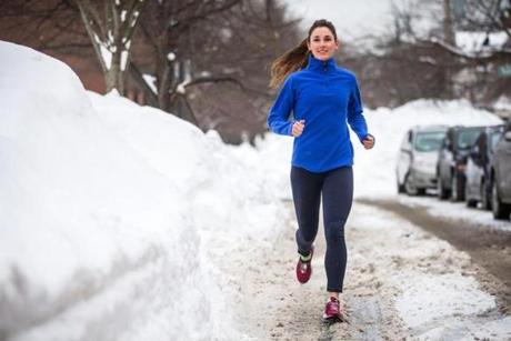 02/12/2015 NEWTON, MA Emily Bliss (cq) 29, runs along Vernon Street (cq) in Newton during her lunch break. (Aram Boghosian for The Boston Globe)

