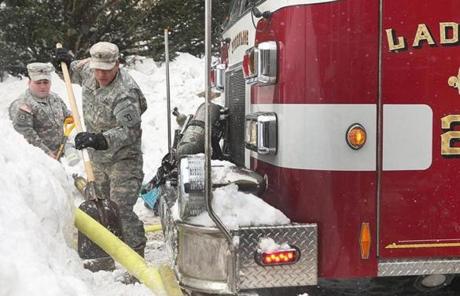 The National Guard helped out at the scene of a three-alarm fire in Brookline.
