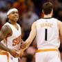 PHOENIX, AZ - JANUARY 21: Isaiah Thomas #3 of the Phoenix Suns celebrates with Goran Dragic #1 after scoring against the Portland Trail Blazers during the second half of the NBA game at US Airways Center on January 21, 2015 in Phoenix, Arizona. The Suns defeated the Trail Blazers 118-113. NOTE TO USER: User expressly acknowledges and agrees that, by downloading and or using this photograph, User is consenting to the terms and conditions of the Getty Images License Agreement. (Photo by Christian Petersen/Getty Images)