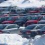 Cars and snow filled the lot at Colonial Volkswagen in Medford.