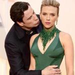 John Travolta (left) kissed Scarlett Johansson as they arrived for the 87th annual Academy Awards ceremony at the Dolby Theatre in Los Angeles on Feb. 22. 