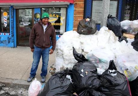 Miguel Zapata, a barber at Billy?s Barbershop on Blue Hill Avenue in Dorchester, said the city has not collected the trash there in two or three weeks.
