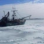 A fishing boat was stuck in ice near Woods Hole on Cape Cod.