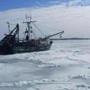 A fishing boat was stuck in ice near Woods Hole on Cape Cod.