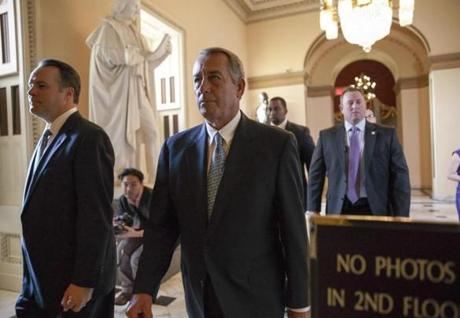 House Speaker John Boehner walked to the House floor for procedural votes.
