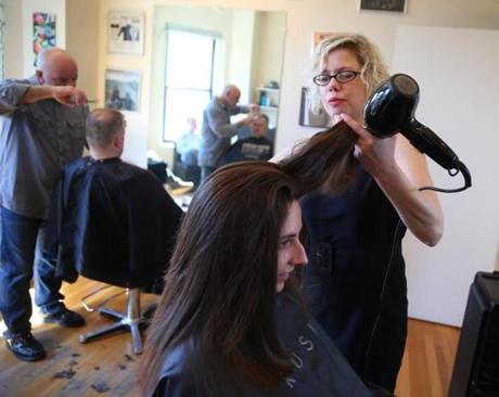 Boston Ma 02/28/2015 Salon owner Michelle Merrill (cq) with customer Danielle Belanger (cq) at Salon 350. The salon's business Taxes are rising because of high property values.Salon 350 is seeing a soaring tax bill. Globe Staff/Photographer Jonathan Wiggs Topic: Reporter
