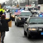 Bourne 03/04/2015: The procession for Injured Bourne Police Officer , makes it's way down Main Street in Bourne after his release from Spaulding Rehab Hospital. Photo by Debee Tlumacki for the Boston Globe (metro) 