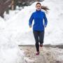 Becca Pizzi used a snowbank to stretch as she trained along Heartbreak Hill on Feb. 27.