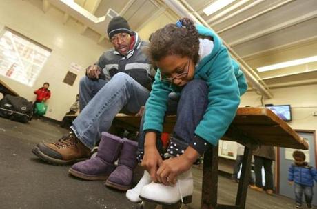Vincent Lampley and his daughter Mya, 10, who attends Milton Academy, laced up for the public skate at Ulin Rink on a recent Sunday.
