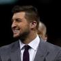 NEW ORLEANS, LA - JANUARY 01: Former University of Florida quarterback Tim Tebow walks onto the field during the All State Sugar Bowl at the Mercedes-Benz Superdome on January 1, 2015 in New Orleans, Louisiana. (Photo by Sean Gardner/Getty Images)