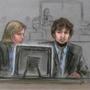 In this courtroom sketch, Dzhokhar Tsarnaev, right, and defense attorney Judy Clarke are depicted watching evidence displayed on a monitor during his federal death penalty trial. 