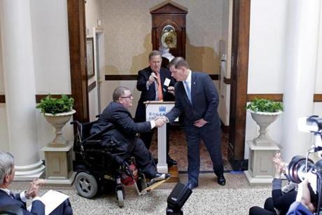 Boston Mayor Martin Walsh shook hands with Thomas Hopkins, who has lived at Beacon House for 15 years, during a ceremony honoring Walsh's commitment to the affordable housing building on Tuesday. Hopkins also service as the Executive Director of the Architectural Access Board for the Massachusetts.
