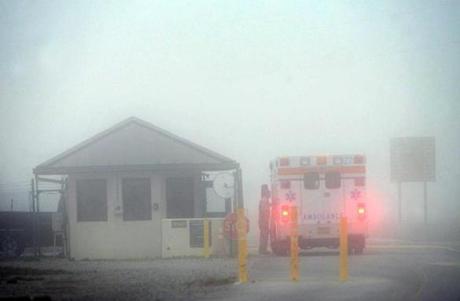 An Okaloosa County ambulance sits at the Eglin Air Force entrance in Fort Walton Beach, Fla., on Wednesday.
