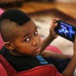 Tafari Amais Edge-Wallace, 10, says he would rather play a baseball video game than watch a real one. ?Watching is boring,? he said.