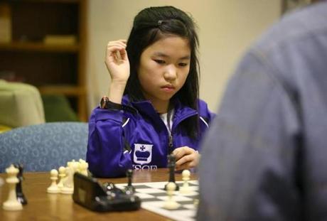 Chess master Carissa Yip, at a game at the Billerica Chess Club, started playing at age 6.
