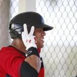 Boston Red Sox' Yoan Moncada waits to bat during practices at spring training, Friday, March 13, 2015, in Fort Myers Fla. The Red Sox have finalized a minor league contract with the 19-year-old Cuban infielder that includes a $31.5 million signing bonus, easily a record for an international amateur free agent under 23 years old. (AP Photo/Brynn Anderson) ) 