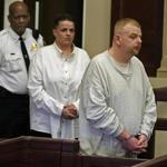 David Oaks, right, and Kathy Oaks, center, were sentenced in Brockton on multiple charges of abuse and rape of a child.