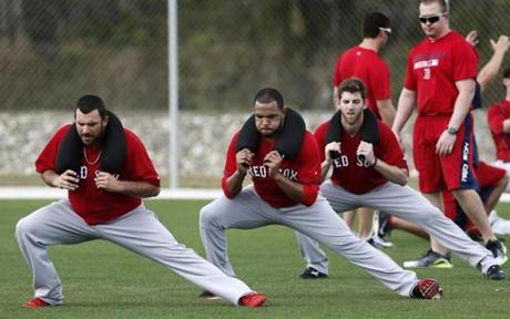 Dana Eveland (left), Edwin Escobar, and Zeke Spruill during a pitchers workout early in spring training.
