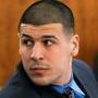 Aaron Hernandez looked over his shoulder during his murder trial on Monday.