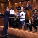 ?Tonight Show? Host Jimmy Fallon (left) gave a gift basket with Taylor Swift concert tickets in it to Villanova Pep Band piccolo player Roxanne Chalifoux.