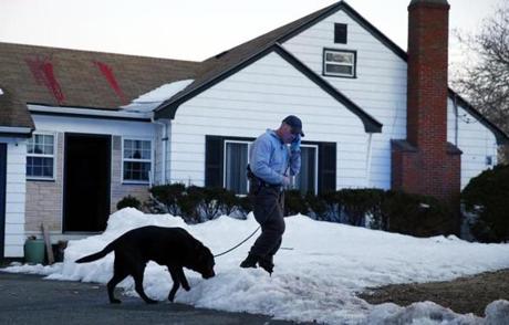 An investigator and a K-9 unit dog were outside a home on Tuesday on Craig Street in Milton where an explosive device had been found and disarmed by police. 
