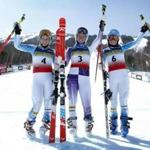 Nina O'Brien, of Vail, Colo., center, celebrates her victory in the women's giant slalom ski race with second place finisher Paula Moltzan, of Lakeville, Minn., left, and Megan McJames, of Park City, Utah, who finished third, at the U.S. Alpine Championships, Thursday, March 26, 2015, at Sugarloaf Mountain Resort in Carrabassett Valley, Maine. (AP Photo/Robert F. Bukaty)
